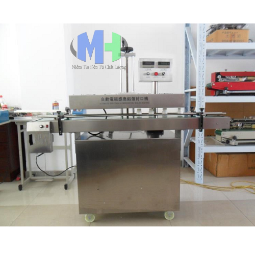 Máy dán seal tự động - Công Ty Cổ Phần Máy Và Thiết Bị Minh Huy